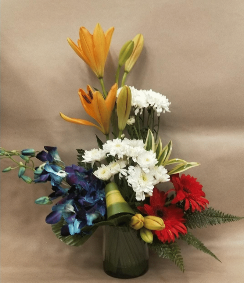 Floral Arrangement with Asiatic Lily, Spray Daisy, Gerbera and Orchids in Glass Vase