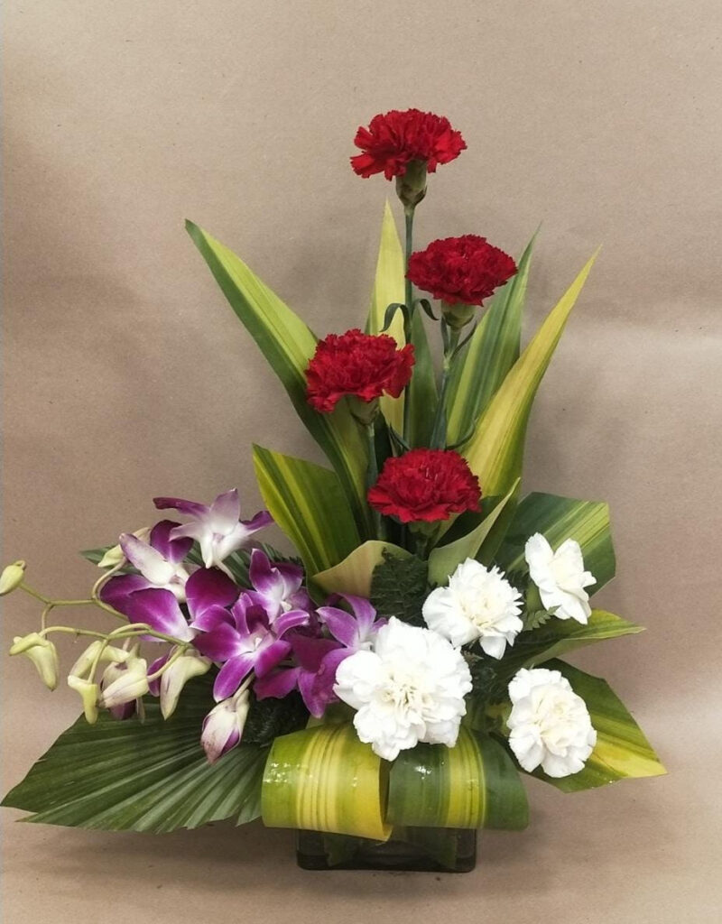 Floral Arrangement with Mix Carnations and Orchids in Glass Vase