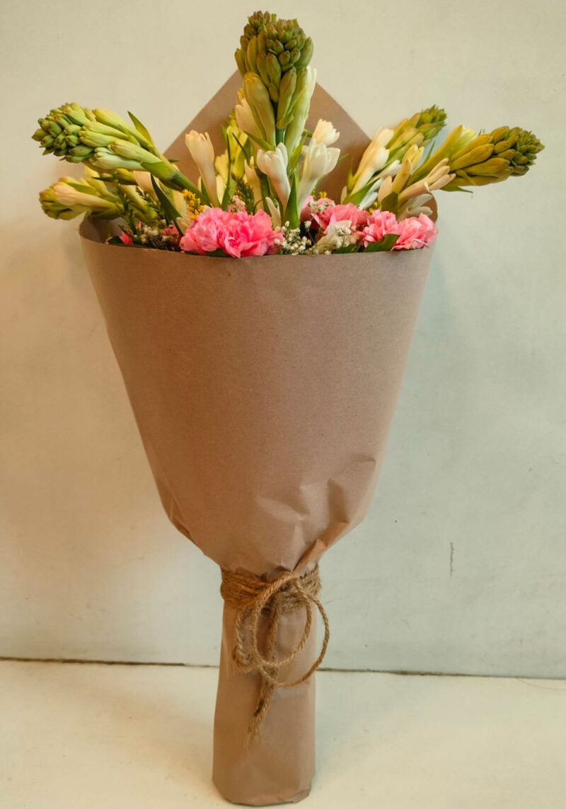 Fragrant Rajnigandha and Carnations in Brown Wrap