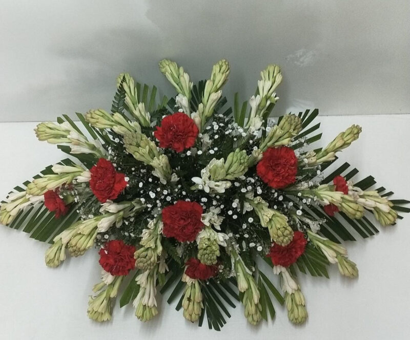 Flower Arrangement with Rajnigandha and Carnations in Glass Vase