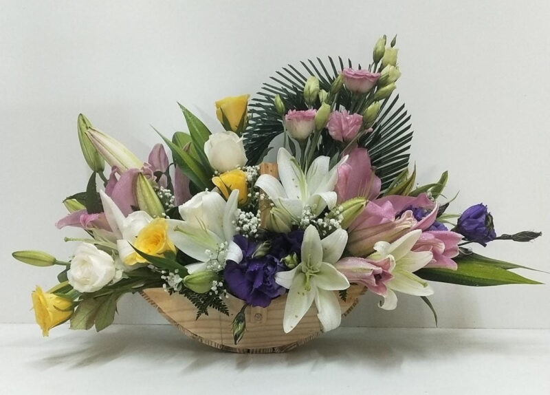 Flower Arrangement with Fragrant Oriental Lily, Eustoma and Rose in Wooden Basket